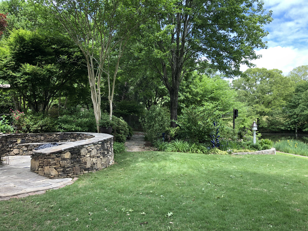 Bermuda set with beds and hardscaping in shady areas