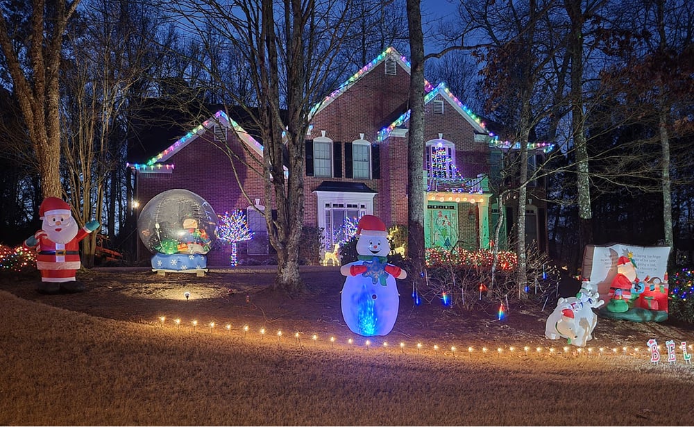 Holiday inflatables in mulched bed not on the the lawn