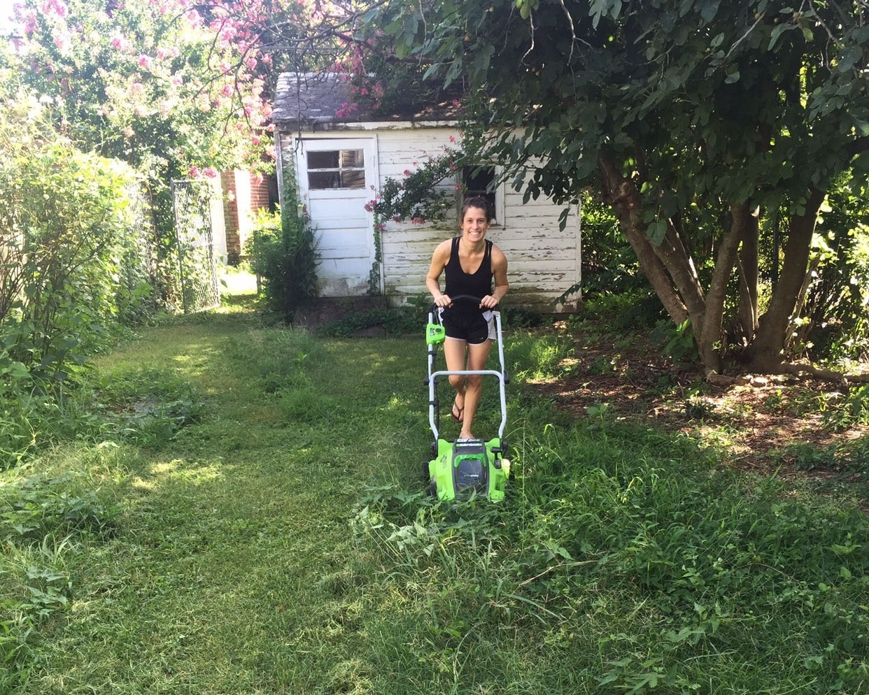 andrea mowing weeds during lawn restoration-558899-edited.jpg