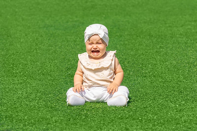 baby on artificial turf