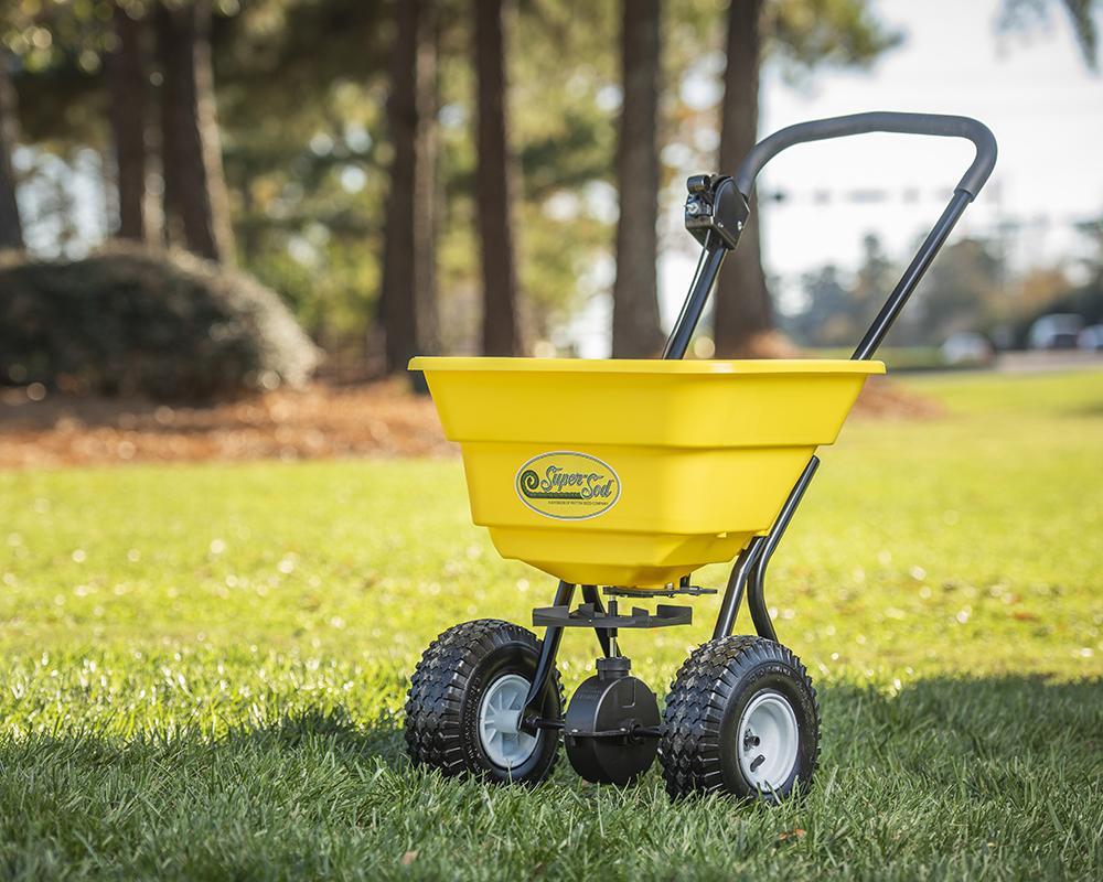 Super-Sod_yellow_push_spreader_outside_1024x1024-1